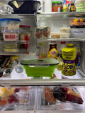 “Reusable pizza slice container shown inside refrigerator for food storage.”